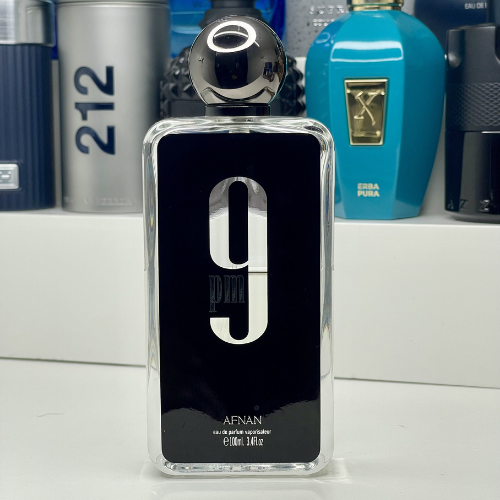 Afnan 9pm Eau De Parfum for Men bottle with black cap and sleek glass design, showcasing the men's fragrance product.